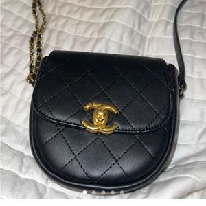 Chanel crossbody bag with gold hardware.